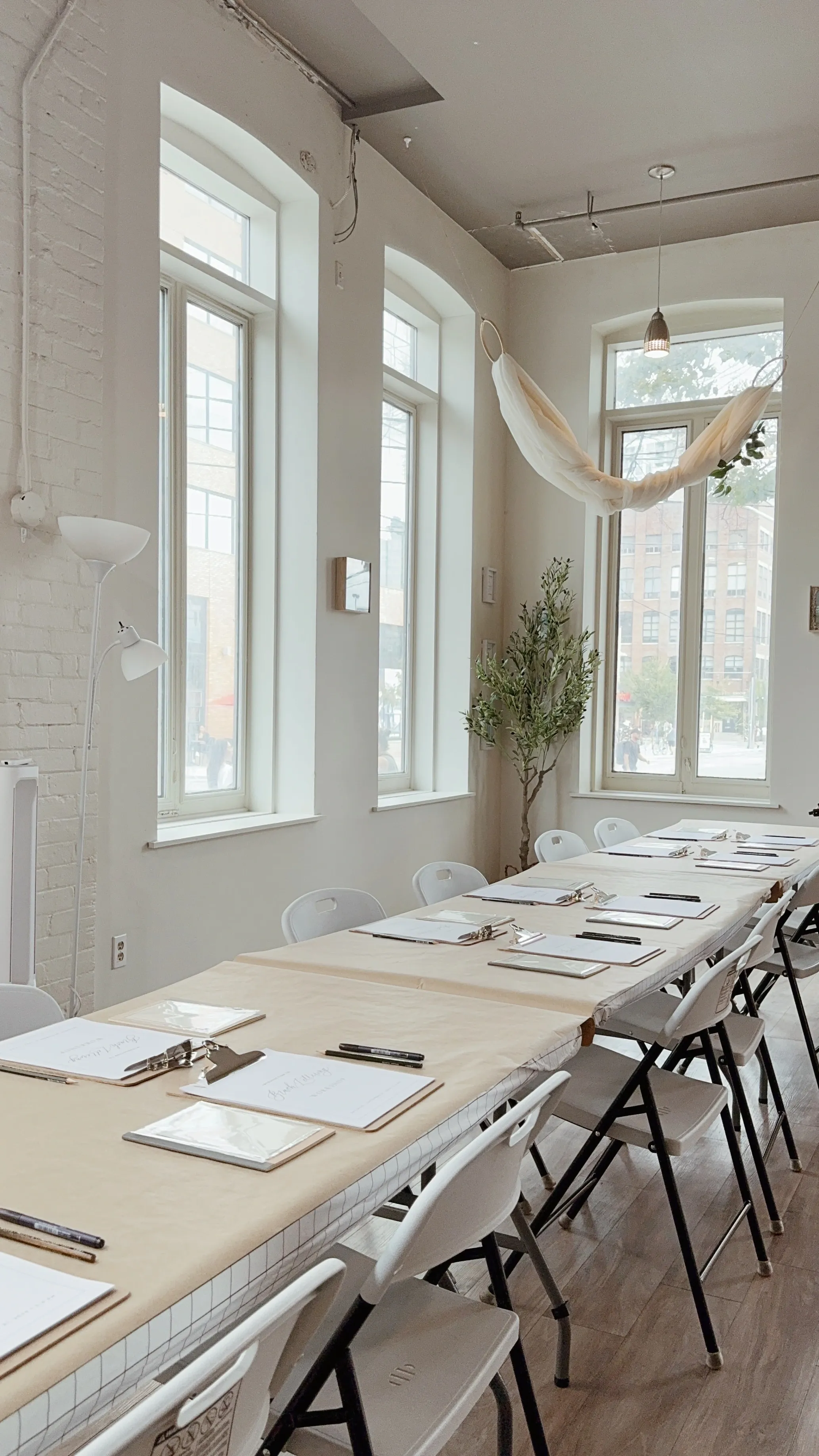 A room with tables full of materials and paper